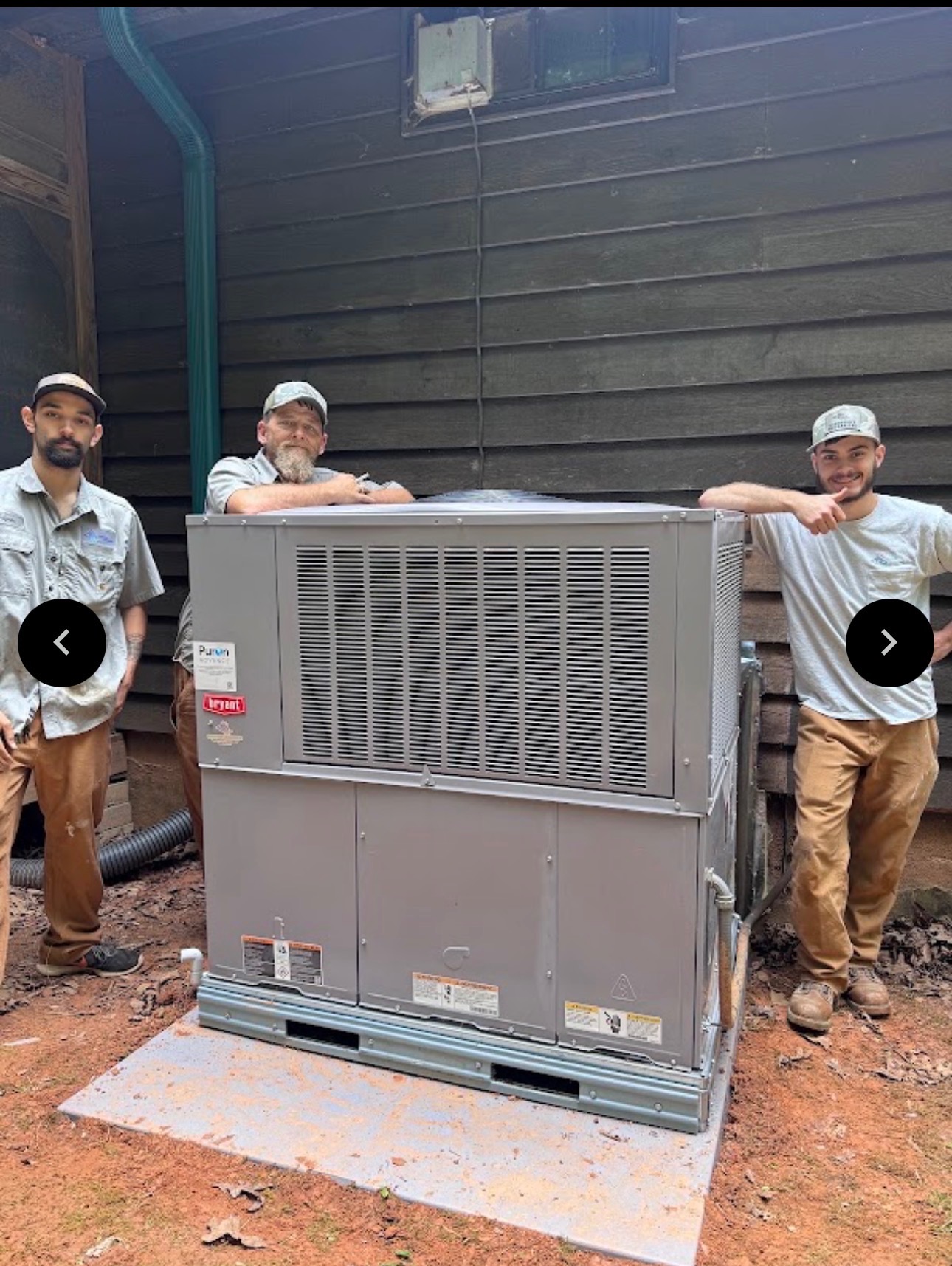 Crawford's Mechanical crew with a newly installed Bryant HVAC system