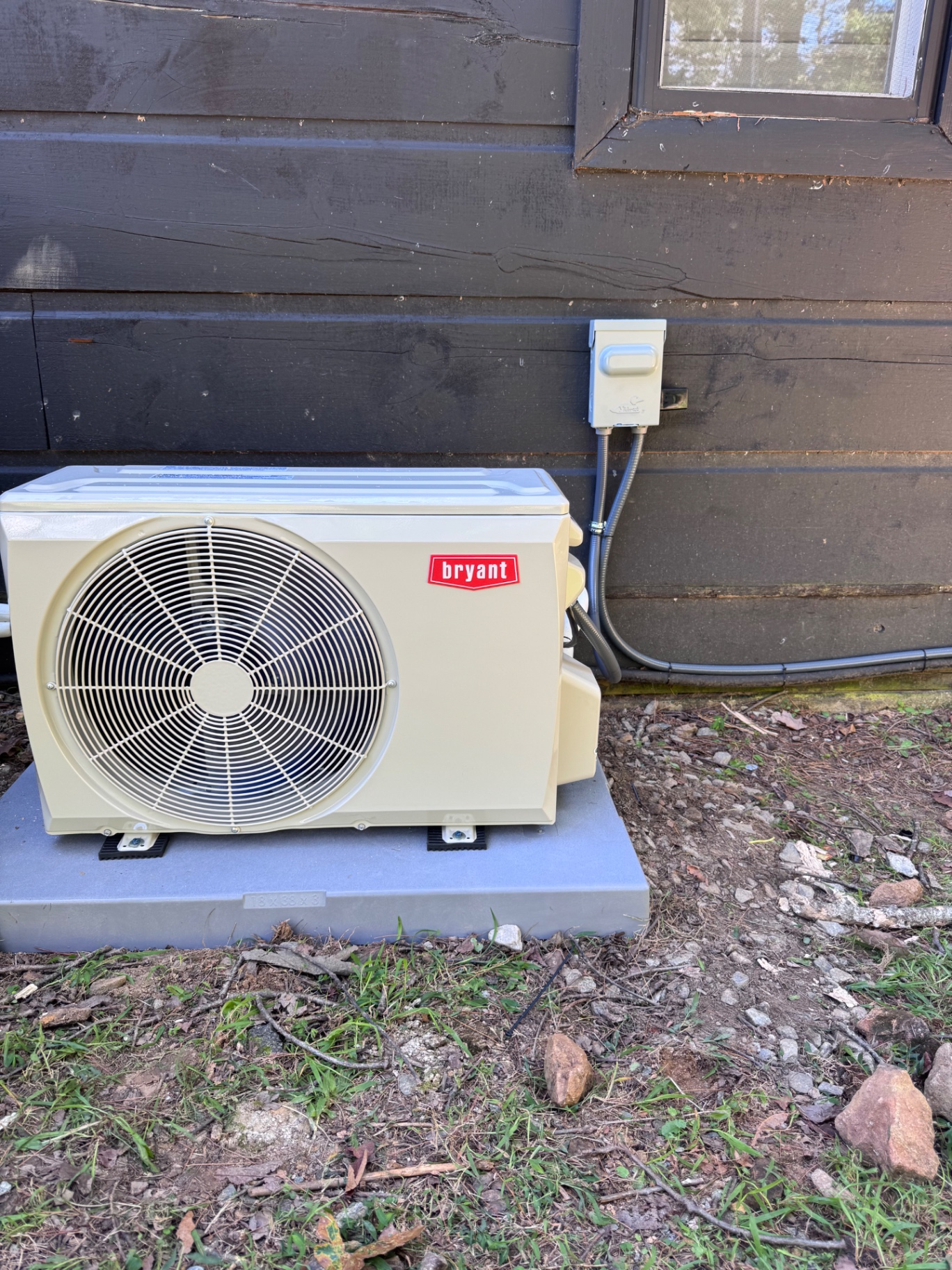 Bryant ductless mini-split outdoor unit installed beside a home